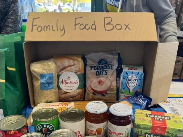 Family food box, contains jars and tins of food.