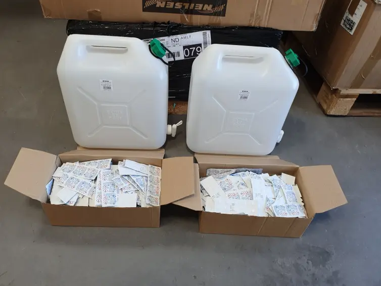 Two water canisters and two boxes of water purification tablets.